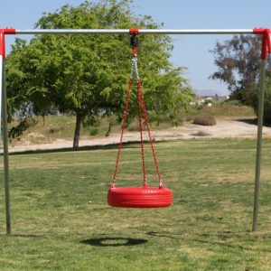 An image of a red tire swing attached to a swing set.